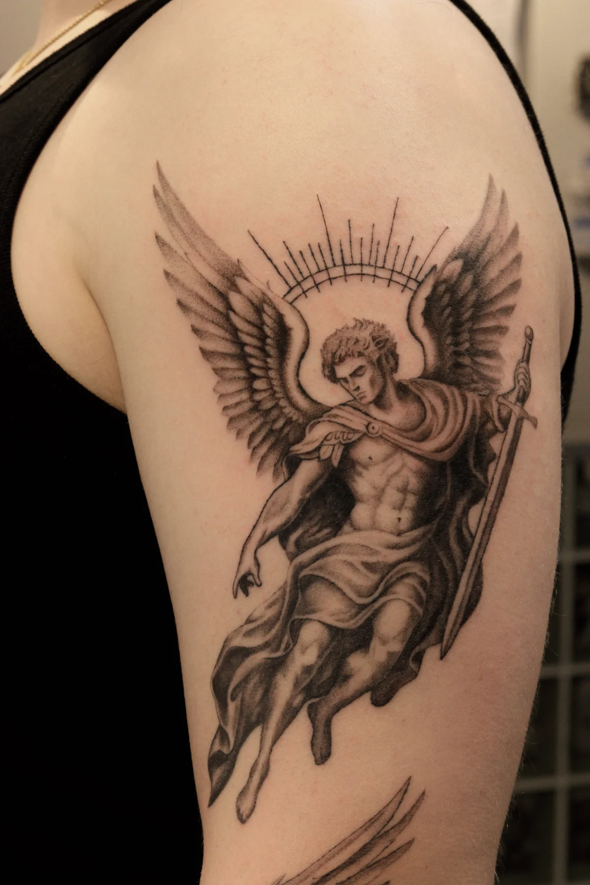 Archangel Michael fine line and black and grey tattoo in Prague by Andrey Kovalov