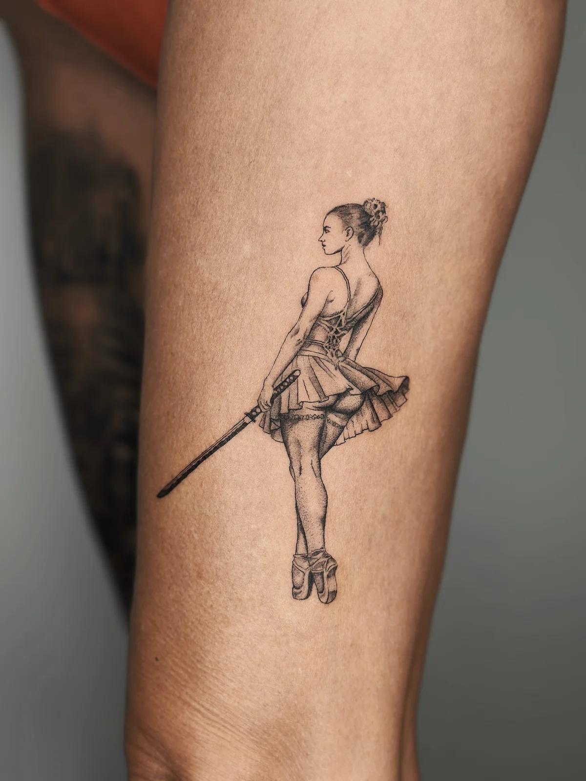 Ballerina with katana microrealism tattoo in Prague by Andrey Kovalov