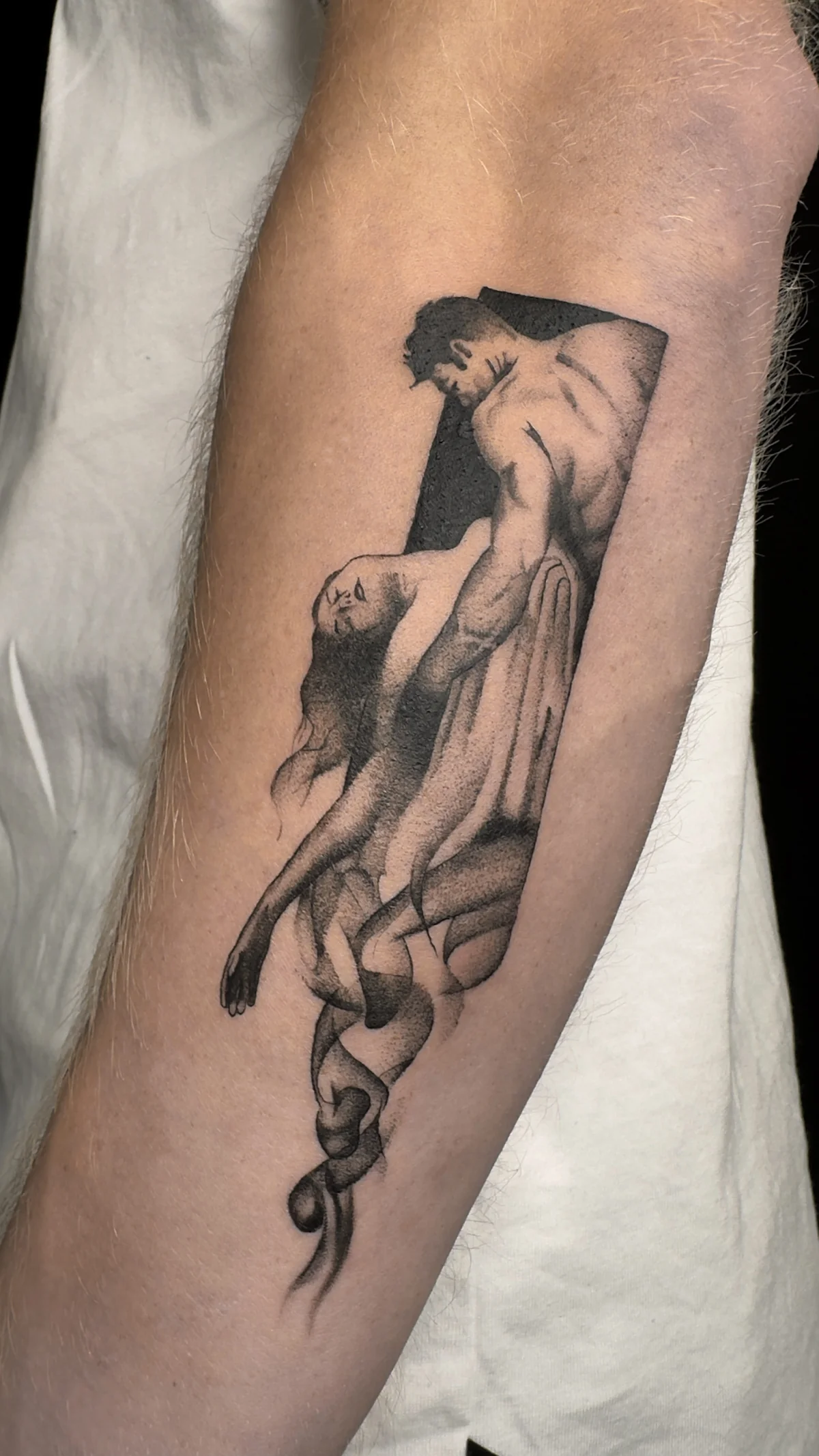 Embrace and serpent symbolic tattoo in Prague by Andrey Kovalov